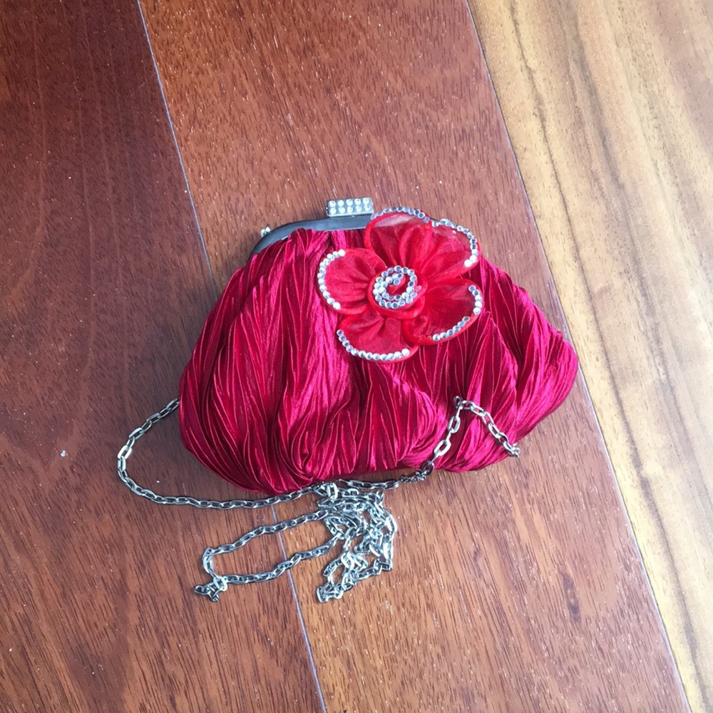 Pleated satin purse with rhinestone embellishments
